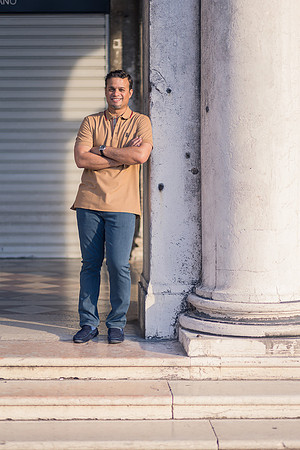 Man posing near historical Venetian columns