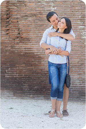 Couple walking hand in hand through a park in Rome