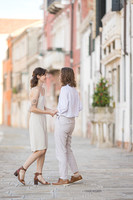 Couple sharing a kiss during Venice engagement photoshoot