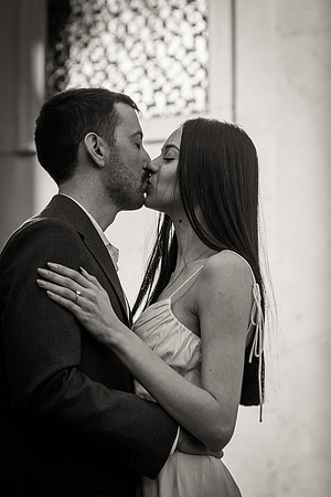 Couple embracing by a window in Venice.