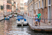 Family on a boat ride along Venice canals