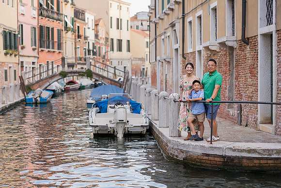Family on a boat ride along Venice canals