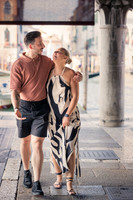Couple walking hand-in-hand in Venice after proposal