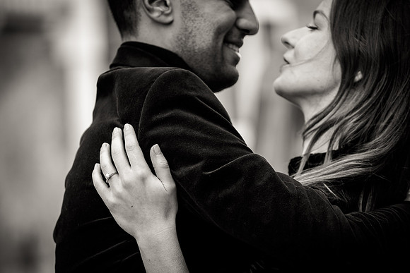 Close-up of a couple embracing and smiling in Venice.