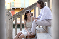 Couple seated together in Venice during engagement
