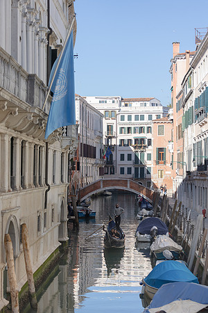 Venetian canal with reflections of old buildings in February.