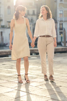 Couple walking hand in hand in Venice