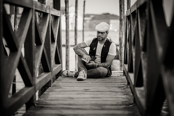 Dr. Matheus Arantes, monochrome, Venetian pier, peaceful.