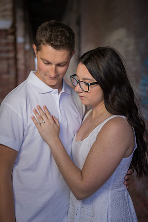 Couple standing near historic Venetian architecture