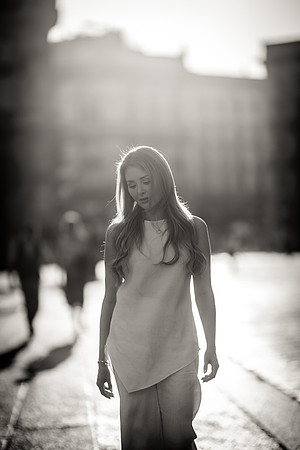 Woman walking in sunlight in Milan