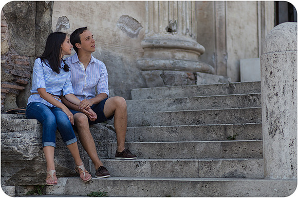 Couple holding hands during a honeymoon in Rome