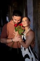 Couple holding roses after proposal in Venice
