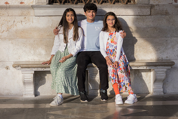 Family of five relaxing in Venice