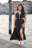 Woman posing after proposal in Venice, glowing with joy.