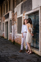 Romantic engagement moment by Venice canal