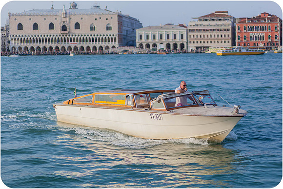 A water taxi gliding through the Grand Canal in Venice, Italy.