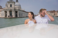 A candid romantic moment before the proposal in Venice.