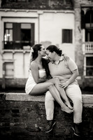 Couple sharing a romantic moment on a Venetian balcony.