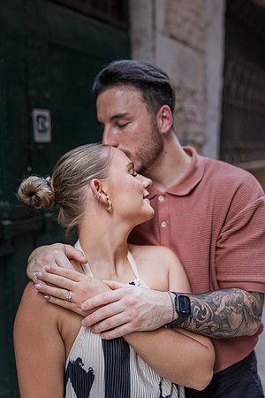 Kiss in Venetian alley after engagement